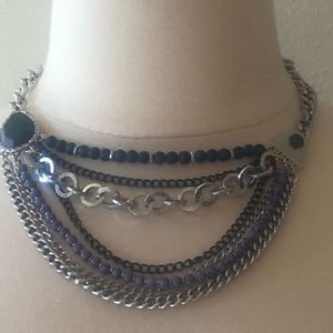 Blue and silver chain and bead necklace.